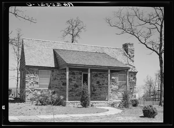 A stone Cumberland Homesteads house photographed in April 1937
