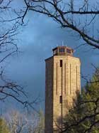 The stone Homesteads Tower beneath a blue sky