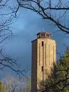 The stone Homesteads Tower beside bare trees